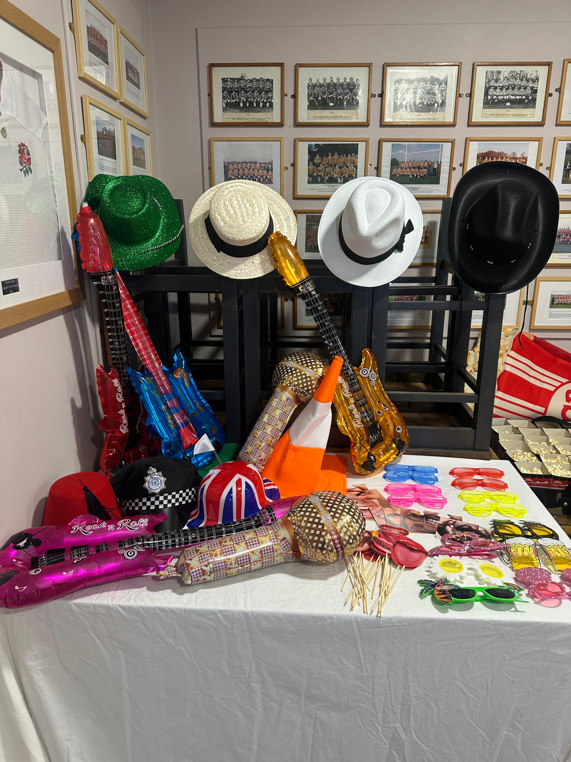 Taylor Event Co. - guests using photo booth at wedding reception with props