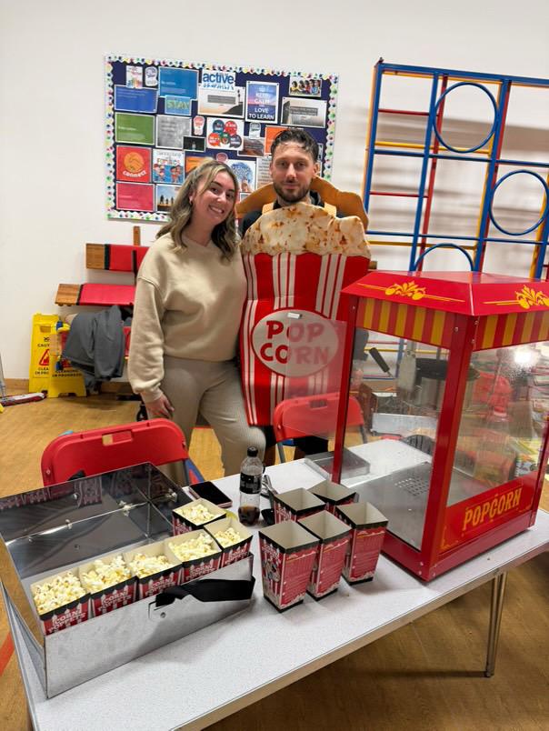 Taylor Event Co. - freshly made popcorn served at event entertainment stand