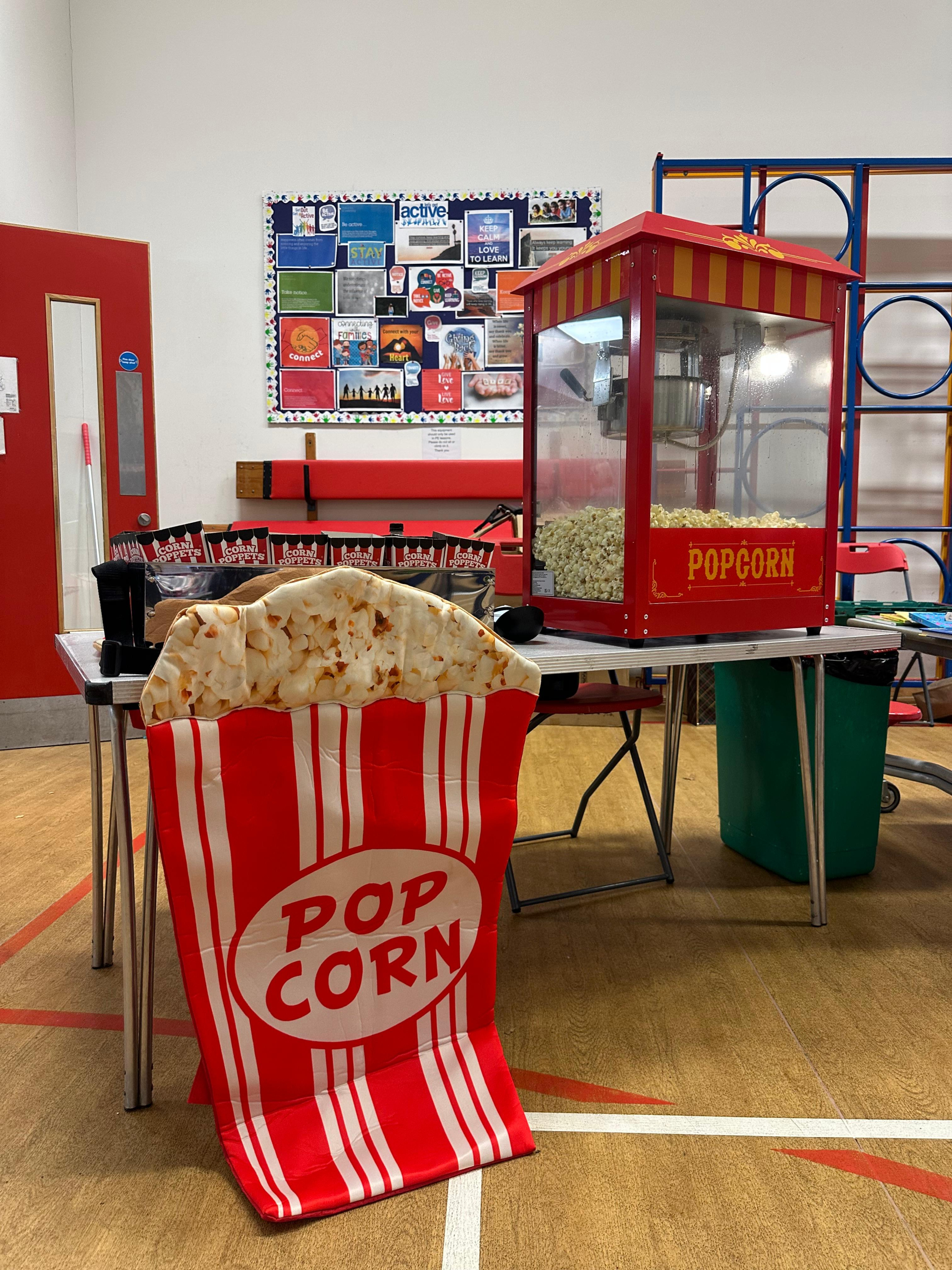 Taylor Event Co. - freshly made popcorn served at event entertainment stand